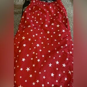 Red with white star pattern elastic band and tie swim trunks. 2XLT